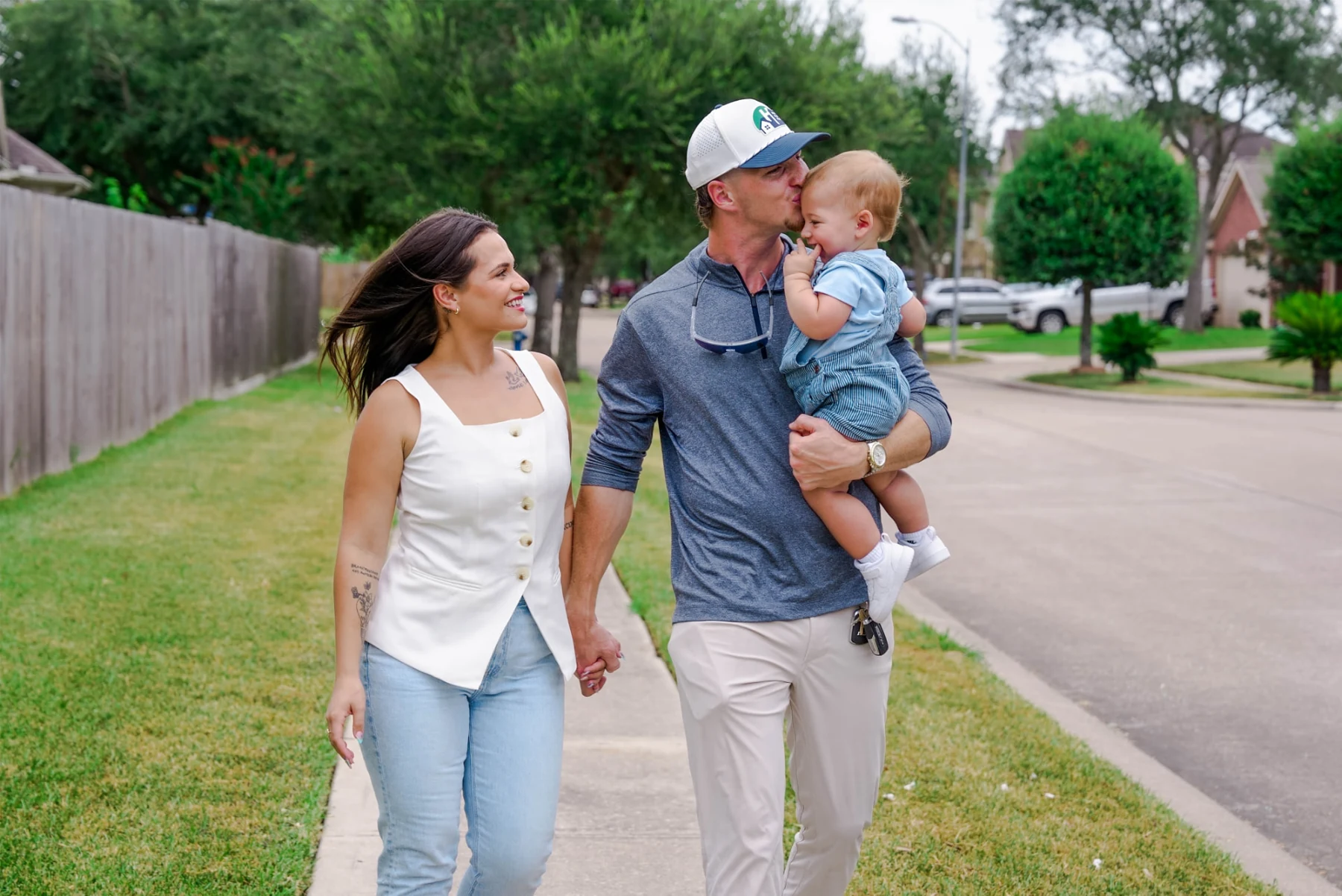 Chance Hill walking with his family in a Texas neighborhood